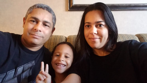 Dakmary Torres (right) in the hotel room with her husband and 5-year-old son.